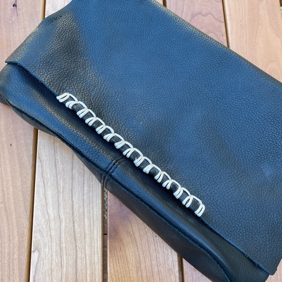 Handbags - A soft leather black clutch purse